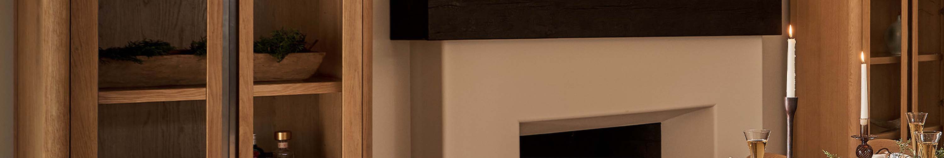 fireplace flanked by two wooden and glass etageres